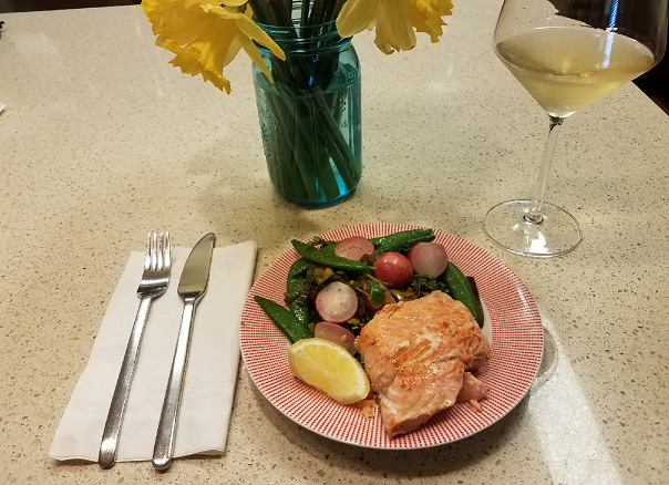 Plated salad with salmon and wine
